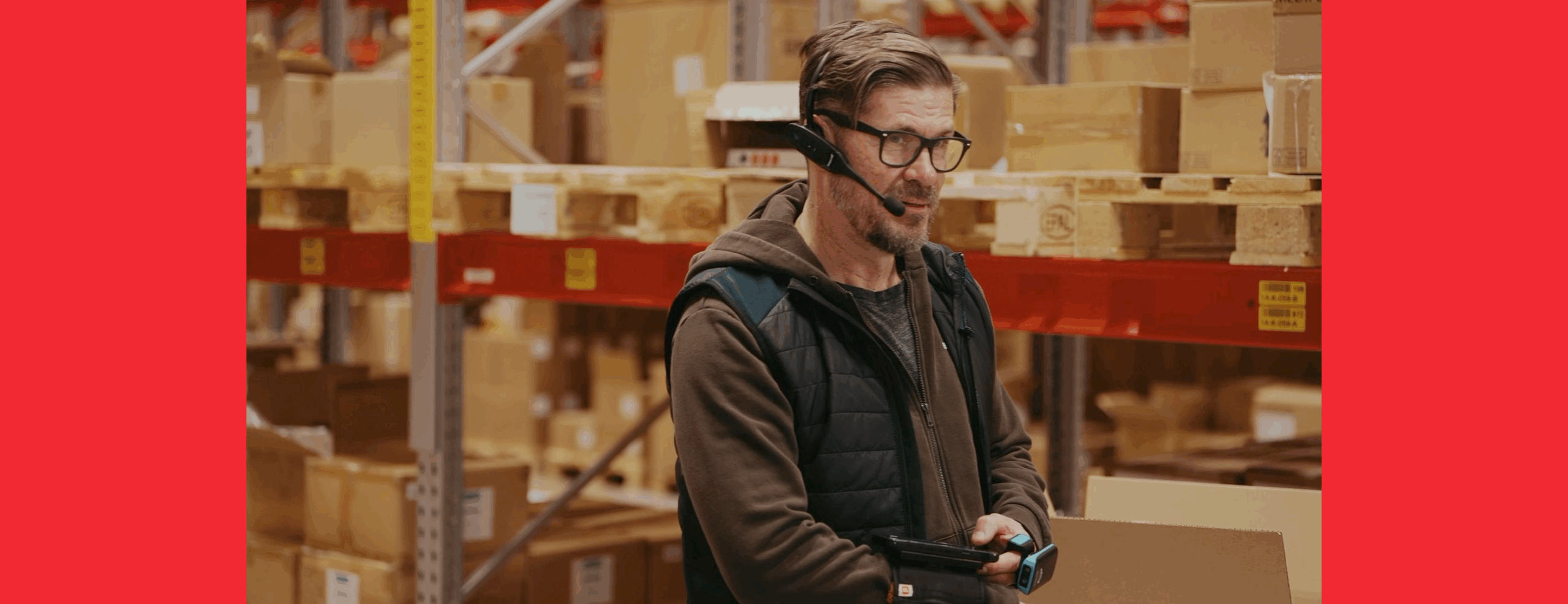 eCommerce warehouse worker using voice picking system for efficient order fulfilment.